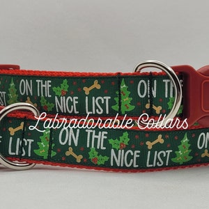 May include: Red and green dog collar with a Christmas tree and bone pattern. The collar has the text "On the Nice List" repeated on it.