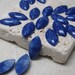Vintage 15x7mm Plastic Navette Cabs in Lapis. 2 dz.