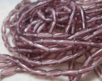 Czech Glass 8x3mm Rice Beads in Light Amethyst.  4 dz.