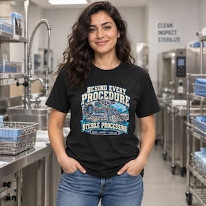 May include: A black t-shirt featuring a graphic with the text "BEHIND EVERY PROCEDURE STERILE PROCESSING" and "CLEAN INSPECT STERILIZE". The design includes illustrations of medical instruments, a tray, and a sterilization machine.