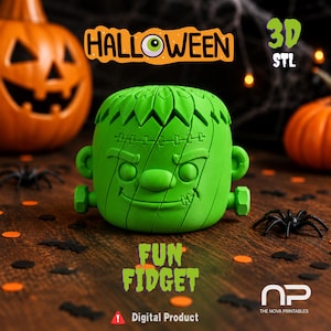 May include: A bright green 3D-printed fidget toy shaped like a stylized monster head with bolts on the sides, a stitched forehead, and a smiling expression. The text HALLOWEEN, 3D STL, FUN FIDGET, and Digital Product are visible in the image.