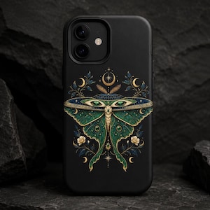 May include: A black smartphone case featuring a detailed illustration of a green moth with gold accents. The moth design includes intricate wing patterns, small white flowers, and celestial symbols like stars and crescent moons centred on the back.