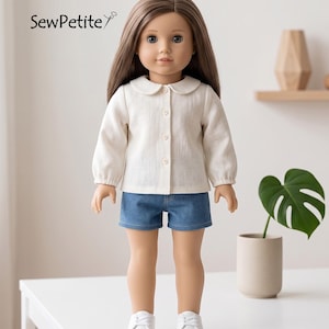 May include: A doll wearing a cream-colored button-down shirt with a rounded collar and denim shorts. The doll has long brown hair and white sneakers. The text "SewPetite" is in the upper left corner.