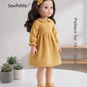 May include: A doll wearing a mustard yellow dress with a Peter Pan collar, long sleeves, and button details. The doll has brown hair, a matching bow, and yellow Mary Jane shoes. The text "Pattern for 14.5" Dolls" is visible.