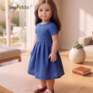 May include: A doll with long brown hair wearing a short-sleeved blue dress and brown shoes with white straps. The doll is standing on a wooden table. The text "SewPetite" is in the upper left corner.