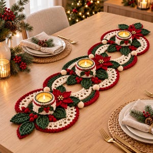 May include: A long, crocheted table runner featuring a repeating pattern of cream, red, and dark green yarn. The runner includes three integrated candle holders decorated with crocheted poinsettia flowers, green leaves, red berries, and wooden beads.