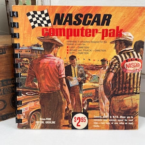 May include: Vintage NASCAR Computer-pak booklet with a checkered flag and illustrations of people near a race car. The cover features the text "NASCAR computer-pak" and the price $2.95.