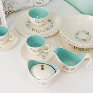 May include: A set of vintage blue and white floral patterned china, including a creamer, sugar bowl, cups, saucers, and a serving bowl.