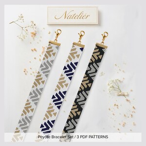 May include: Three long, narrow peyote stitch bracelets featuring geometric chevron patterns in white, gold, navy blue, and black. Each bracelet is finished with a gold-tone metal end bar and a lobster claw clasp. The text Natelier is visible.