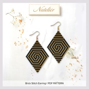 May include: A pair of diamond-shaped beaded earrings featuring a black and gold geometric spiral pattern. The earrings hang from gold-toned metal hooks. Above the earrings, a rectangular label displays the text Nateliér. Below, text reads Brick Stitch Earring / PDF PATTERN.