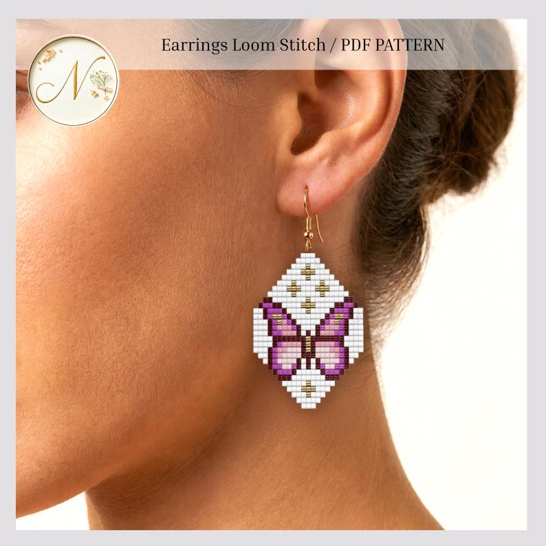 May include: A diamond-shaped earring featuring a loom stitch bead pattern of a butterfly in shades of purple, white, and gold. The design includes the text Earrings Loom Stitch / PDF PATTERN at the top. The earring hangs from a gold-toned hook.