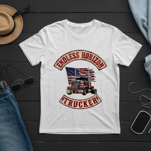 May include: A white short-sleeved t-shirt featuring a graphic of a semi-truck in front of a distressed American flag. The text ENDLESS HORIZON is arched above the truck, and the word TRUCKER is arched below, both in a weathered, vintage-style font.