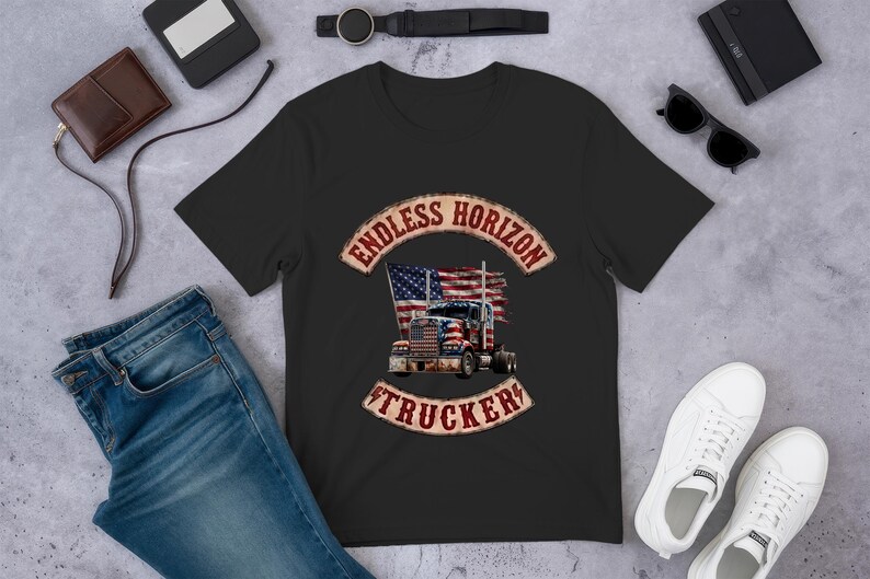 May include: A black short-sleeved t-shirt featuring a graphic of a semi-truck with an American flag design. The text ENDLESS HORIZON TRUCKER is printed in a distressed red font in an arched banner above and below the truck illustration.