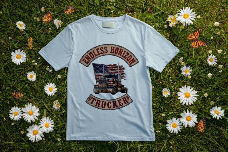 May include: A light blue t-shirt featuring a graphic print of a semi-truck with an American flag design. The text "ENDLESS HORIZON" is arched above the truck, and the word "TRUCKER" is arched below, both in a distressed, weathered red font.
