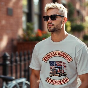 May include: A white short-sleeved t-shirt featuring a graphic print of a semi-truck in front of a distressed American flag. The text ENDLESS HORIZON is arched above the truck, and the word TRUCKER is arched below in a vintage-style font.