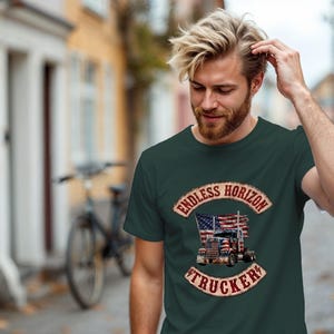 May include: A dark green t-shirt featuring a graphic print of a semi-truck with an American flag design. The text "ENDLESS HORIZON" is arched above the truck, and the word "TRUCKER" is arched below, both in a distressed, weathered font style.