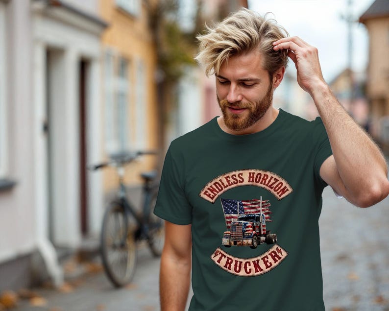 May include: A dark green t-shirt featuring a graphic print of a semi-truck with an American flag design. The text "ENDLESS HORIZON" is arched above the truck, and the word "TRUCKER" is arched below, both in a distressed, weathered font style.