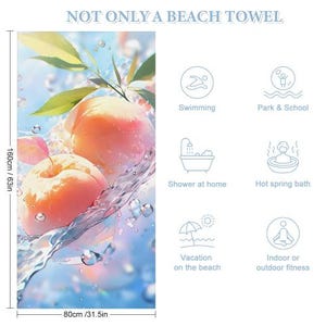 May include: Beach towel featuring a vibrant illustration of peaches with water droplets and leaves. The towel is 63 inches long and 31.5 inches wide. Text at the top reads "NOT ONLY A BEACH TOWEL". Includes icons for various uses.