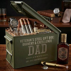 May include: An olive green metal gift box with the text "Veteran's Steel Gift Box: Bravery & Excellence" and the word "DAD". The box contains cigars, a watch, a bottle of liquor, and a multi-tool. A bottle of "Veteran's Blend" liquor is next to the box.