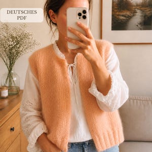 May include: A peach-colored sleeveless knit vest with a ribbed hem and front opening, worn over a white long-sleeved blouse with ruffled cuffs and a tie-neck detail. The text DEUTSCHES PDF is visible in the upper left corner of the image.