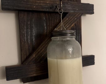 Rustic hanging mason jar candle lantern.