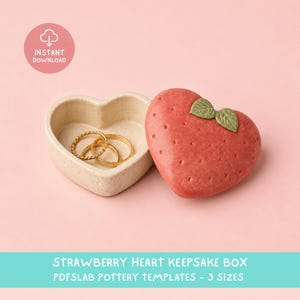 May include: A heart-shaped keepsake box with a textured cream-colored base and a red strawberry-shaped lid featuring green leaves. Inside the open box are two gold rings. The text INSTANT DOWNLOAD and STRAWBERRY HEART KEEPSAKE BOX PDFSLAB POTTERY TEMPLATES - 3 SIZES is visible.