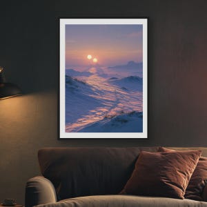 May include: A framed wall art print depicting a snowy landscape under a twilight sky with two suns on the horizon. The scene features rolling white snow dunes with long shadows and a faint path leading toward the distant, glowing celestial bodies.