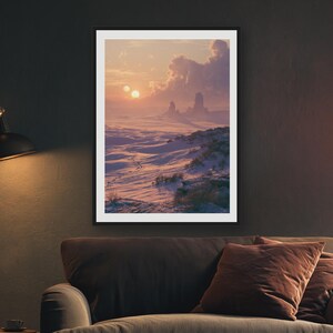 May include: A framed wall art print depicting a desert landscape at sunset with two suns visible in the sky. The scene features rolling sand dunes, rocky formations, and sparse vegetation under a soft, warm-toned sky with scattered clouds.