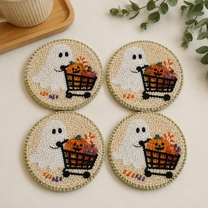 4pcs punch needle coaster set featuring a tiny ghost driving a cart of candy, cute handmade textile table decor for autumn and spooky season