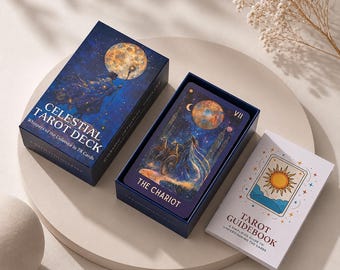 May include: A Celestial Tarot Deck box with a dark blue starry night illustration and a full moon, an open box revealing The Chariot card featuring a figure in a chariot under a moon, and a white Tarot Guidebook with a sun illustration on the cover.