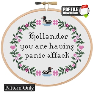 May include: A cross-stitch pattern in a wooden hoop with the text "Hollander you are having panic attack". The design includes a floral wreath with pink flowers, green leaves, and two loon illustrations. The words "Pattern Only" are at the bottom.