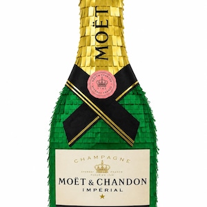 Peut inclure: Une piñata en forme de bouteille de champagne verte et dorée avec le texte "MOËT" en haut. La bouteille a un ruban noir et un emblème circulaire rose. L'étiquette indique "MOËT & CHANDON IMPÉRIAL" et "PRODUIT DE FRANCE BRUT".