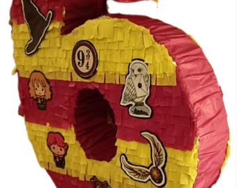 Handmade number 6 piñata with a magic theme, perfect for a child's birthday party and personalized decorations.