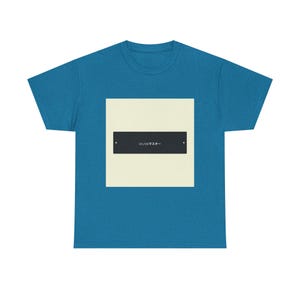 May include: A teal-colored t-shirt featuring a cream-colored square with a black rectangle in the center. The black rectangle has white Japanese text. The t-shirt is made of a soft, comfortable material.
