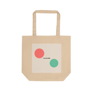 May include: A beige tote bag with a white square graphic. The graphic features a coral-coloured circle above a teal circle. The text "TensorFlow" is printed in black below the coral circle. The bag has two beige handles.