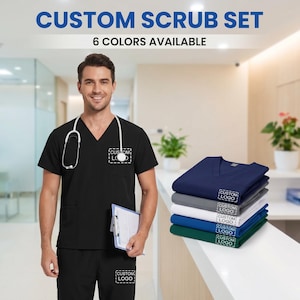 May include: A black scrub set with a V-neck top and matching pants. The top has a pocket with a custom logo. The image also shows a stack of six different colored scrub tops, each with a custom logo. The text at the top says "CUSTOM SCRUB SET" and "6 COLORS AVAILABLE."