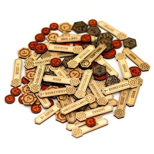 May include: A collection of wooden game tokens and counters. The tokens are various shapes, including rectangles, hexagons, and circles. Some tokens have text like "CHALLENGER +3" and "CAN'T SING". The colors are natural wood, brown, and red.