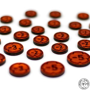 May include: A collection of wooden game pieces with negative numbers, including -2, -3, and -5, scattered on a white surface. The pieces are red and have a dark brown border.
