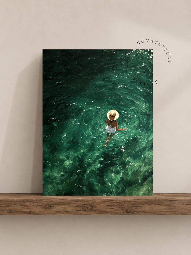 May include: A rectangular wall art print featuring a high-angle view of a person wearing a straw hat and white clothing wading in deep emerald green water. The surface of the water shows ripples and light reflections. The text NOVATEXTURE is visible.