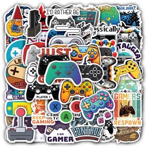 May include: A collection of assorted vinyl stickers featuring various video game controllers, joysticks, and gaming-themed text such as I'D RATHER BE, JUST ONE MORE GAME, GAMERS DON'T DIE THEY RESPAWN, and CONTROL INSECURITY in a variety of colors.
