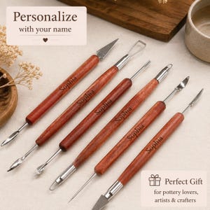 May include: A set of six double-ended pottery sculpting tools with polished wooden handles, each engraved with the name Sophia. The metal tips include various shapes such as loops, blades, needles, and spatulas for detailed clay modelling work.