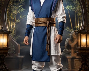 May include: A costume featuring a white long-sleeved tunic and matching trousers, layered with a sleeveless blue tabard. The outfit includes a wide, textured bronze-coloured sash with braided tassels, blue forearm wraps, blue leg wraps, and a black conical hat.