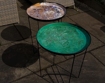 Paint pour abstract colourful metal tables