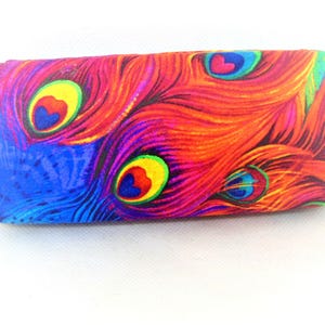 Woman&#39;s hard eyeglass case expertly handmade with a brilliant PEACOCK PRINT.  Wonderful vision aid as well as a fashion accessory