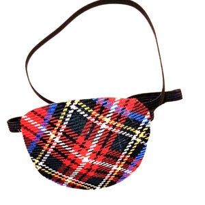 Może przedstawiać: Czarno-czerwono-niebiesko-żółty łatkę na oko w kratę z elastycznym paskiem.