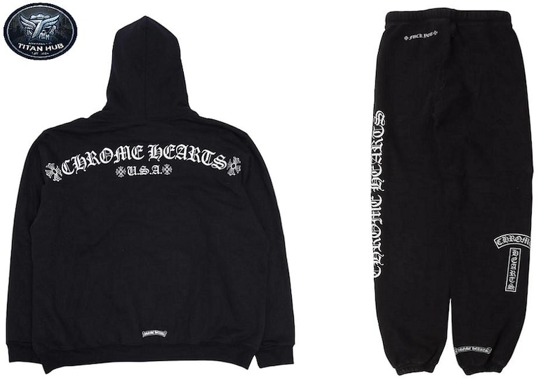 May include: Black hoodie and sweatpants set. The hoodie features the text "CHROME HEARTS U.S.A." in white script across the back. The sweatpants have "CHROME HEARTS" printed vertically down the side in white script. A Titan Hub logo is visible.