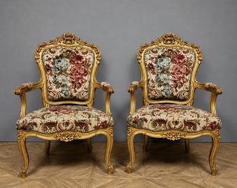 Pair of Louis XV style carved and gilded wooden cabriolet armchairs, French work from the early 20th century.