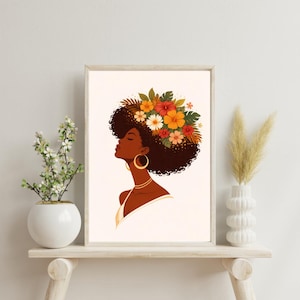 May include: A framed art print featuring a profile of a woman with dark skin, adorned with a floral headdress. The artwork showcases a woman with large gold hoop earrings and a delicate gold necklace. The color palette includes warm tones of orange, red, and brown.