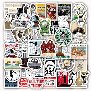 May include: A collection of colorful stickers featuring various illustrations and text. The stickers include images of a green monster, a white rabbit, a knight, and text such as "No one expects the Spanish Inquisition!" and "Taunters Coffee".