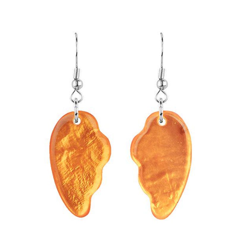 May include: A pair of earrings with a heart-shaped design. The earrings are a warm orange color with a textured, shimmering surface. They hang from silver-colored hooks.